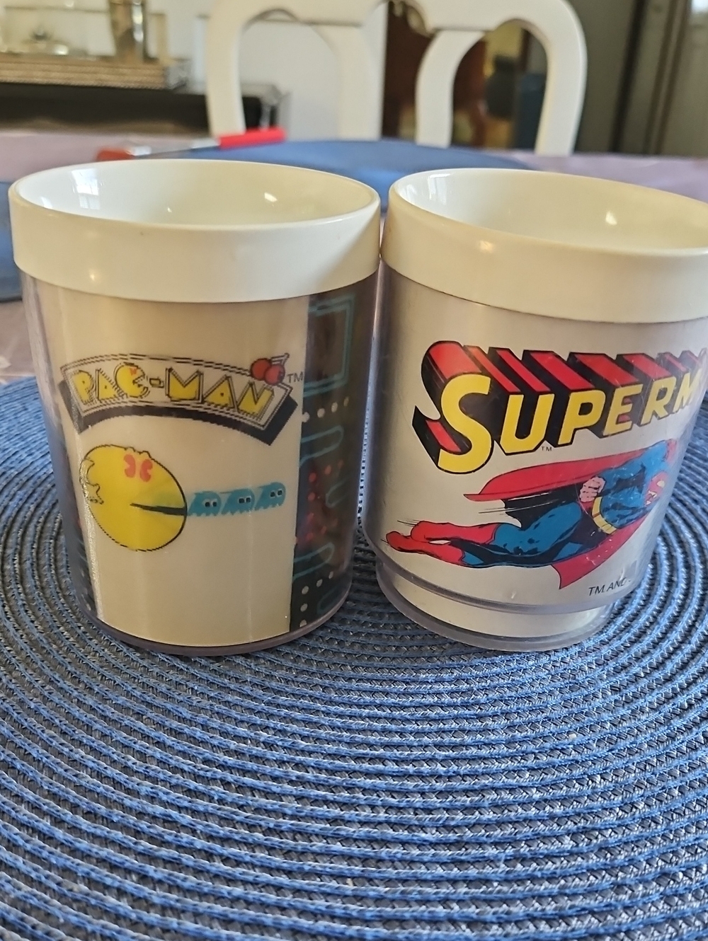 Vintage Superman and pacman cups for collecting, NOT for drinking.